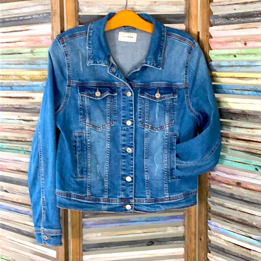 Denim jacket medium blue color.